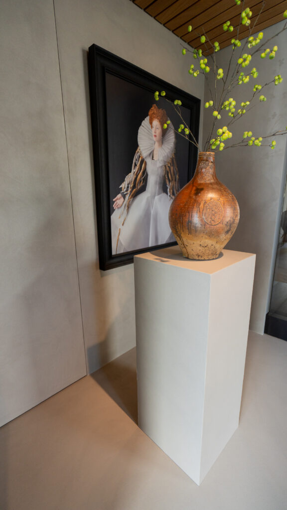 Artistic display with vase and painting