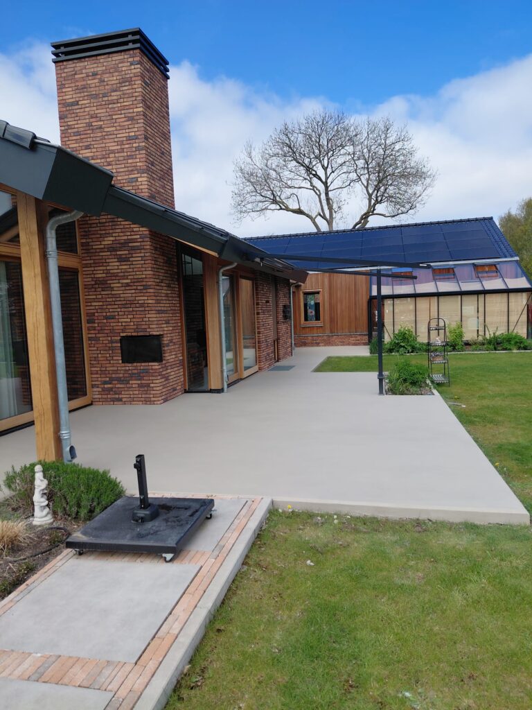 Modern house with patio and garden